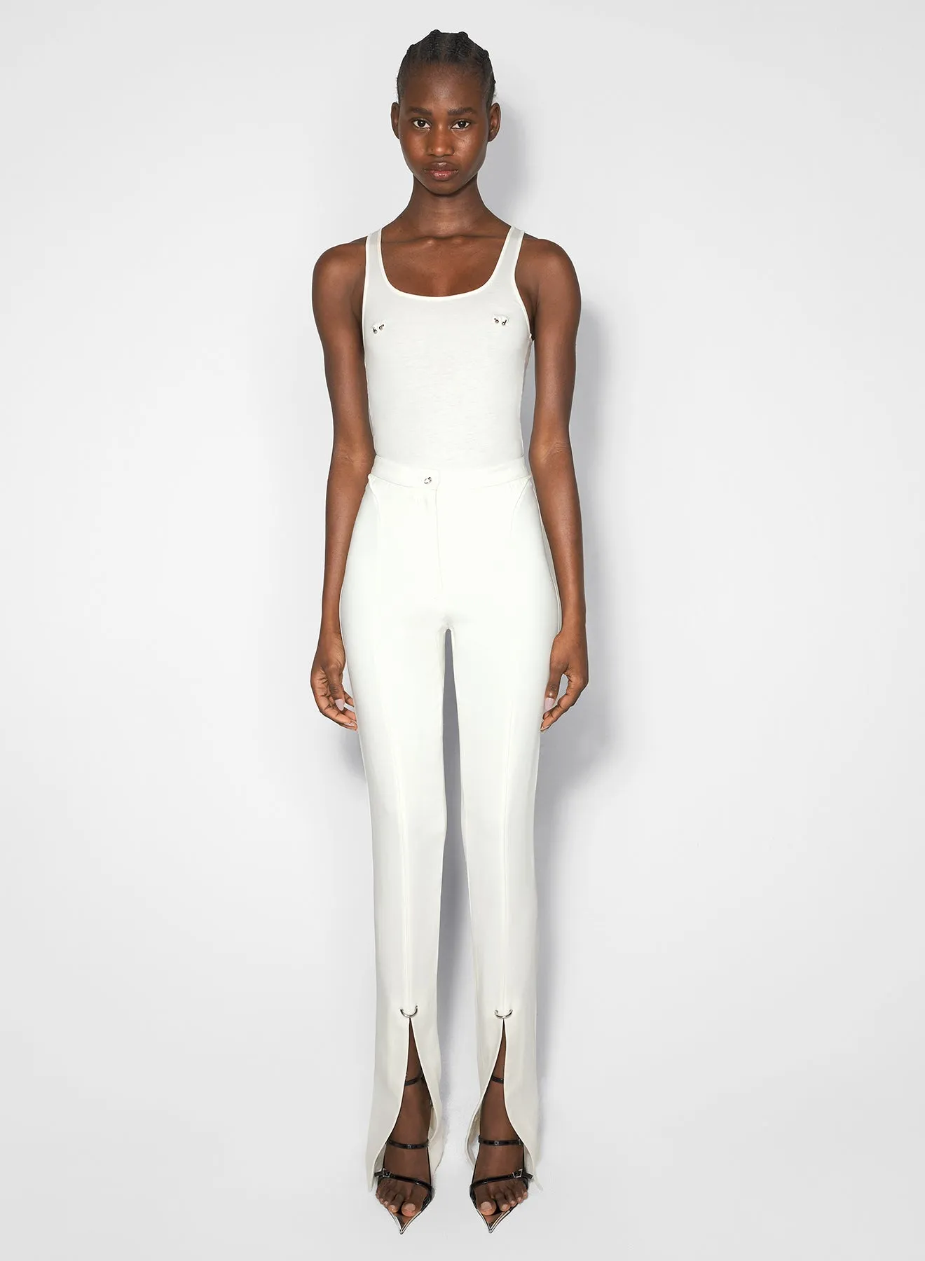 white pierced pants